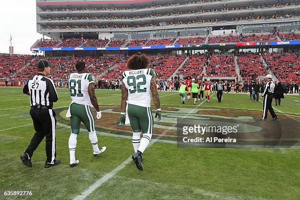 Defensive Lineman Leonard Williams and Wide Receiver Quincy Enunwa of the New York Jets participate in the coin toss against the San Francisco 49ers...