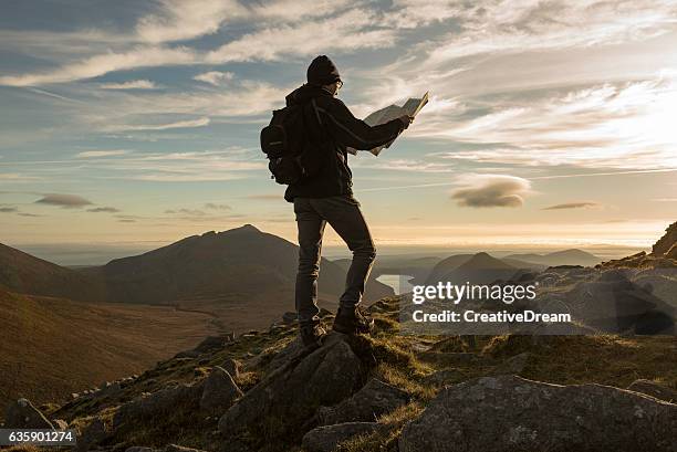 hiker with map, mourne mountains, northern ireland - irish day stock pictures, royalty-free photos & images