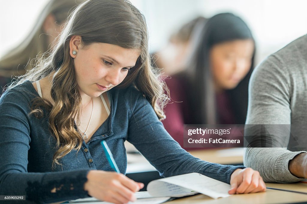 Student Class Assignment Doing A Homework Assignment In Class High-Res Stock Photo - Getty Images