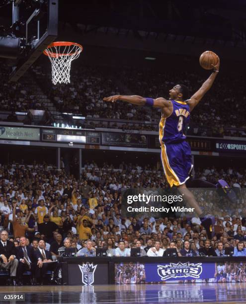 Kobe Bryant of the Los Angeles Lakers dunks the ball during game 1 of the Western Conference Finals during the 2002 NBA Playoffs against the...