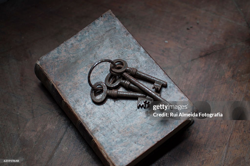 Old keys on top of an old book