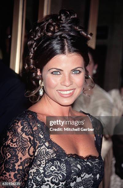Actress Yasmine Bleeth wears a black lace gown at the CFDA, or Council of Fashion Designers of America, Awards at Lincoln Center.