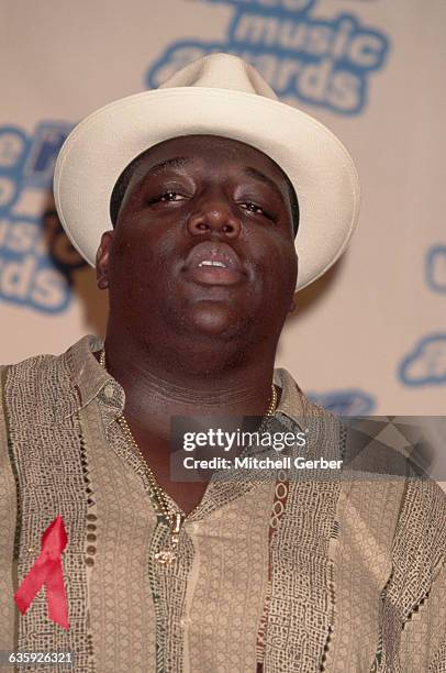 East Coast gangsta rapper Chris Wallace, known as The Notorious B.I.G., attends the MTV Video Music Awards wearing an AIDS ribbon.