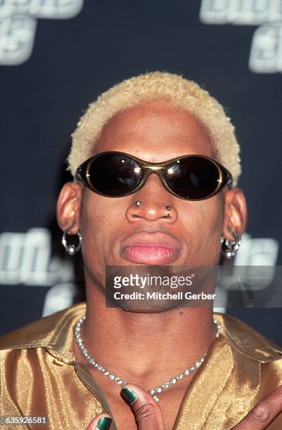 Basketball star and actor Dennis Rodman fashionably attends the MTV Video Music Awards at Radio City Music Hall. Sheer clothing, luxurious materials,...