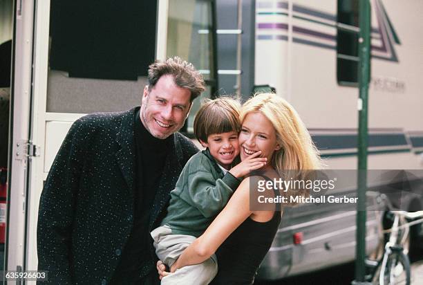 Actress Kelly Preston gets a visit from husband John Travolta and son Jett while on location filming the 1997 motion picture "Addicted to Love."
