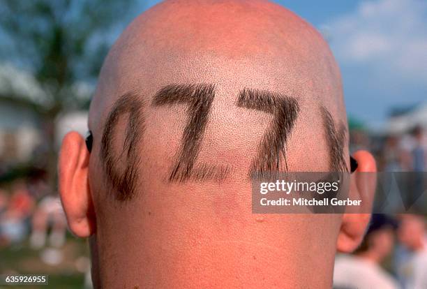 Holmdel, NJ: An Ozzy Osbourne fan is shown from the back of his head where he has "Ozzy" shaved into his head at the "Ozzfest" at the PNC Bank Arts...
