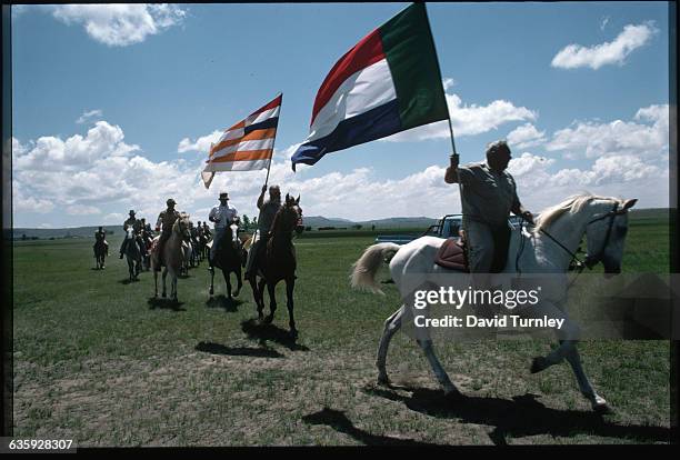 Members Riding Horses at a Rally