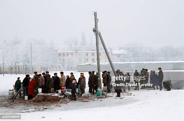 City dwellers gather to get water from a well near Grozny. Water has been scarce as a result of the conflict with Russia.