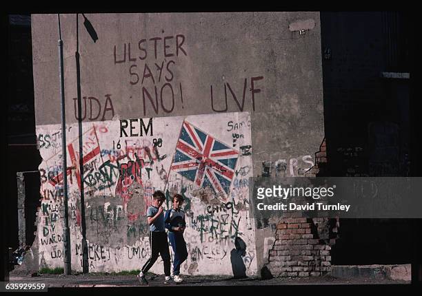 Political mural which has all the important symbols of the Northern Irish Loyalists - the Union Jack, the Ulster flag, the Red Hand, references to...