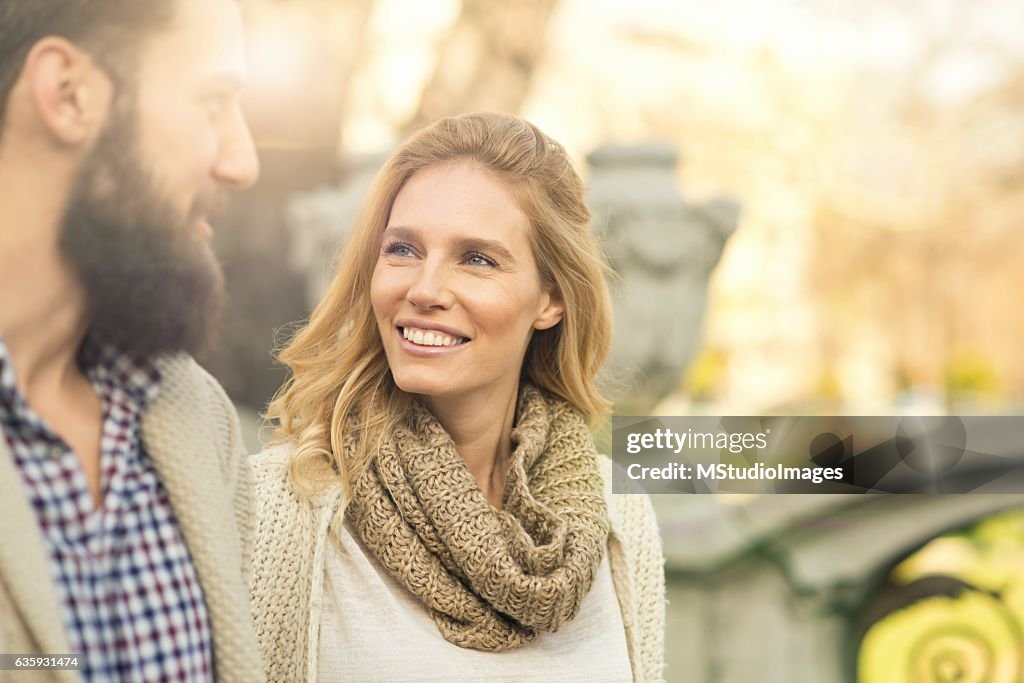 Happy couple walking around the city.