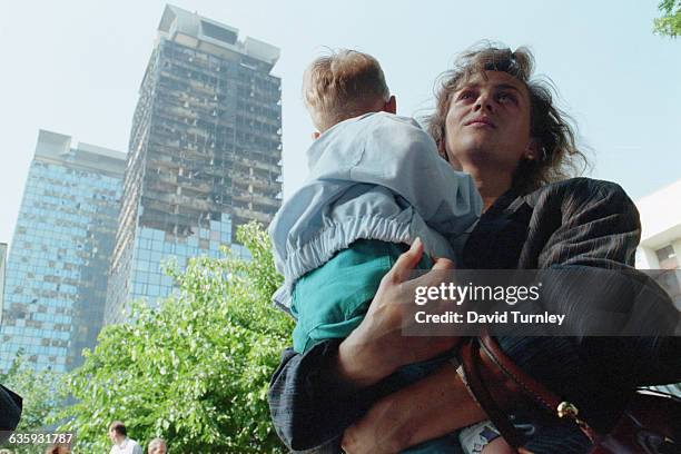 Woman and Child near Bombed-Out Sarajevo Building