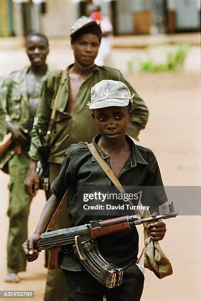 Fifteen-year-old Sunday Sensomba serves as a National Resistance Army soldier under President Yoweri Museveni. Museveni led a guerrilla war against...