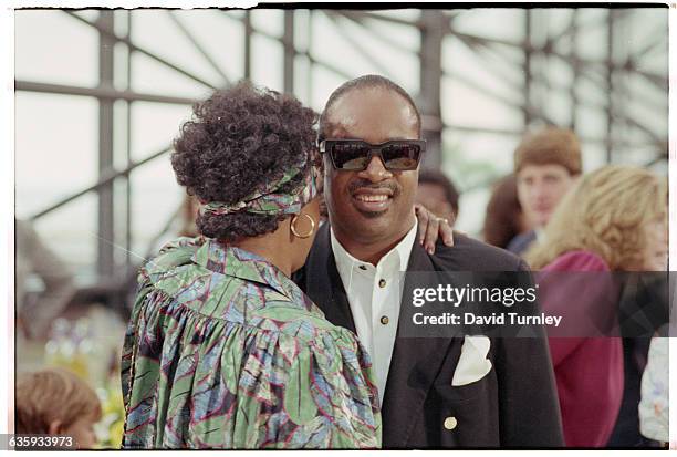 Winnie Mandela, wife of anti-apartheid activist Nelson Mandela, hugs singer Stevie Wonder in Boston in 1990. Nelson Mandela, who was recently...