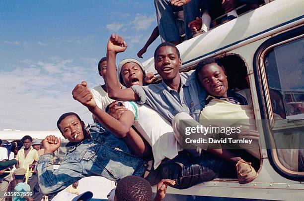 South African men cheer and celebrate the news of Nelson Mandela's release from prison.