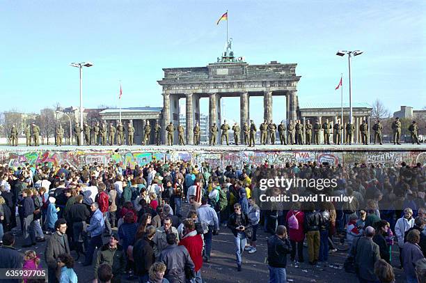 East Germans wait for money being given to them by banks in West Berlin.