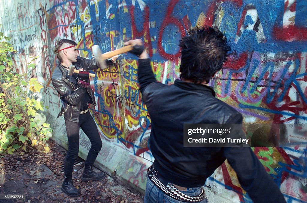 Youths Chipping Away at Berlin Wall