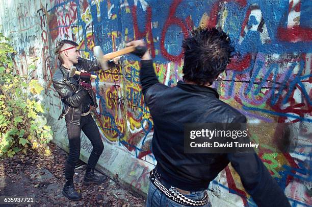 Youths Chipping Away at Berlin Wall