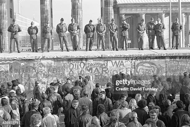 Border Guards Standing on Berlin Wall