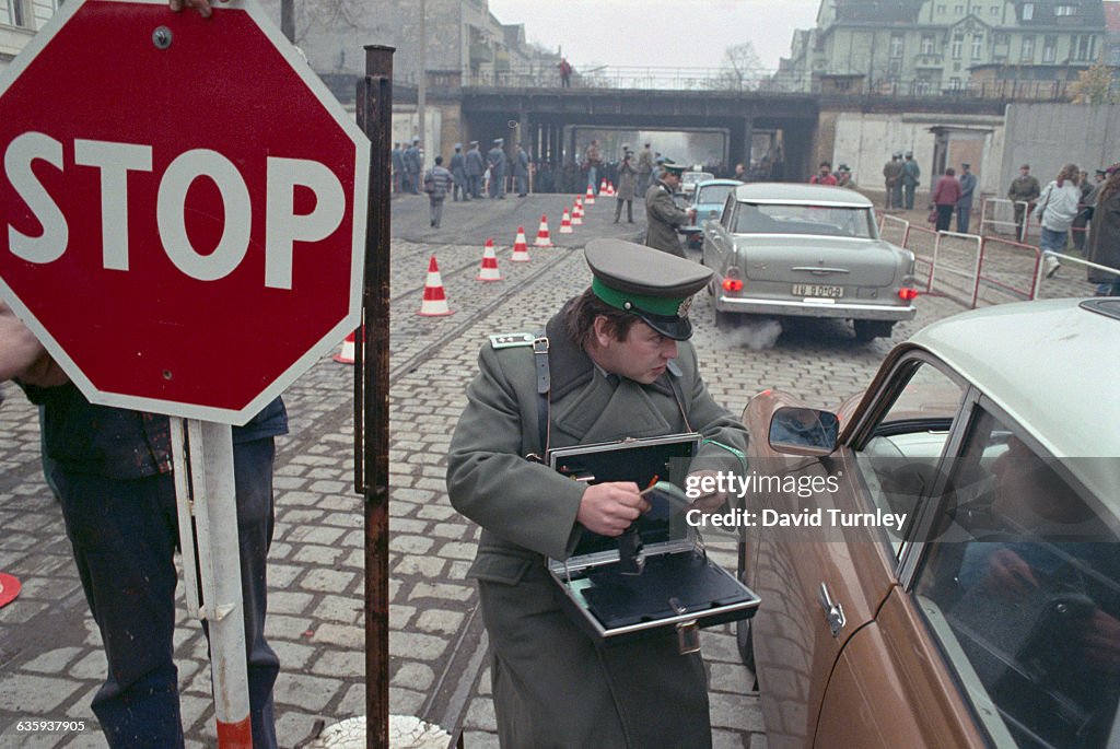 Border Guard Checking Passports