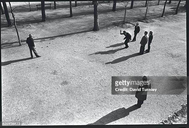 Men Playing Boules in a Park