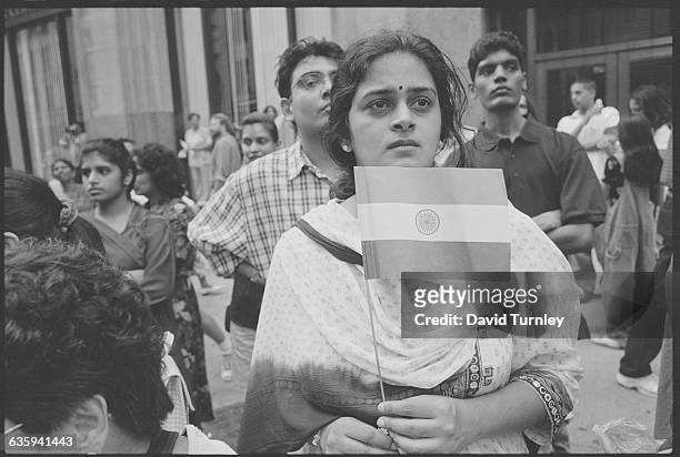 Woman from India Holding an Indian Flag
