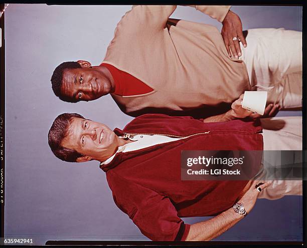 Portrait of Bill Cosby and Robert Culp showing them from the waist up.