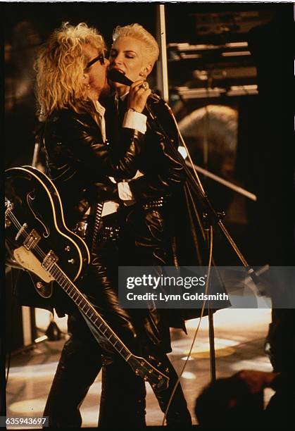 The Eurythmics, Dave Stewart and Annie Lennox, perform on stage.