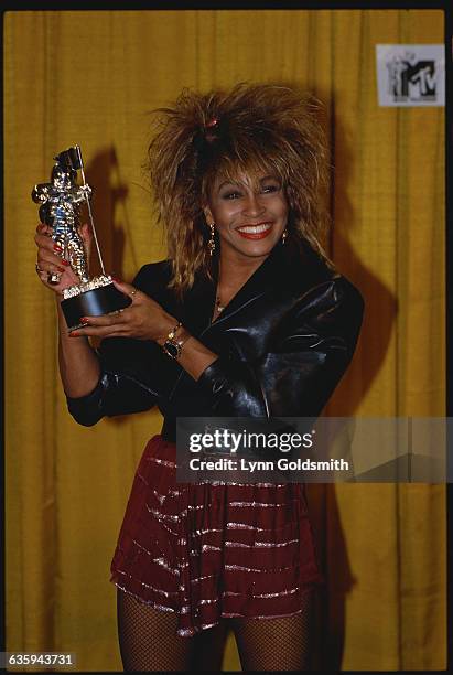 Tina Turner Holding an MTV Music Award