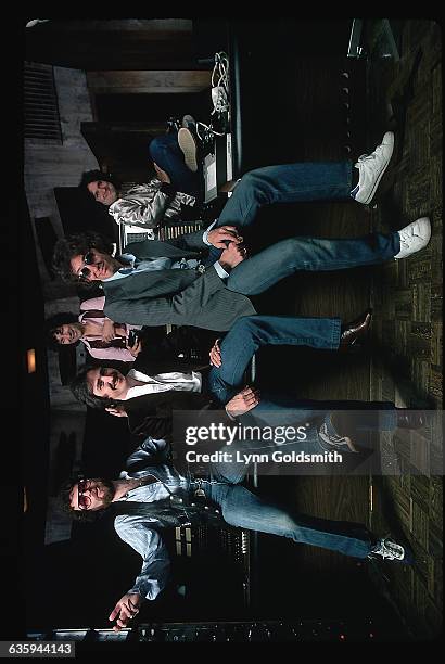 The rock and roll group Blue Oyster Cult is shown posed in what appears to be a musical studio.