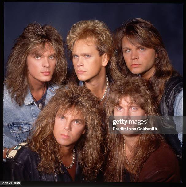 Picture shows the members of the band, Europe, posing head-to-head ina studio.