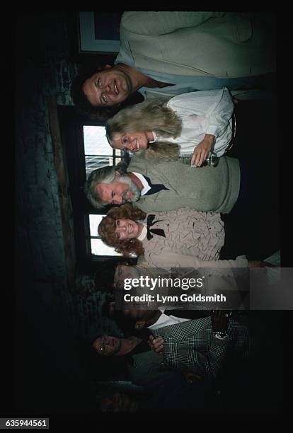 Group of pop and country music stars, including Sammy Davis Jr. And Kenny Rogers, pose together.