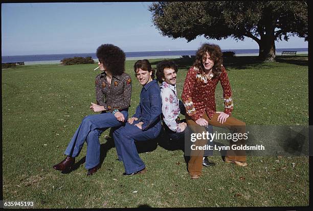 Members of Grand Funk Railroad , sit on an imaginary park bench in Miami Beach, FL.
