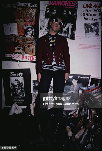 Punk Rocker in Front of Rock Posters