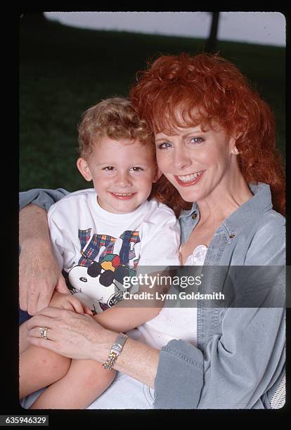 Country singer Reba McEntire hugs her young son Shelby.