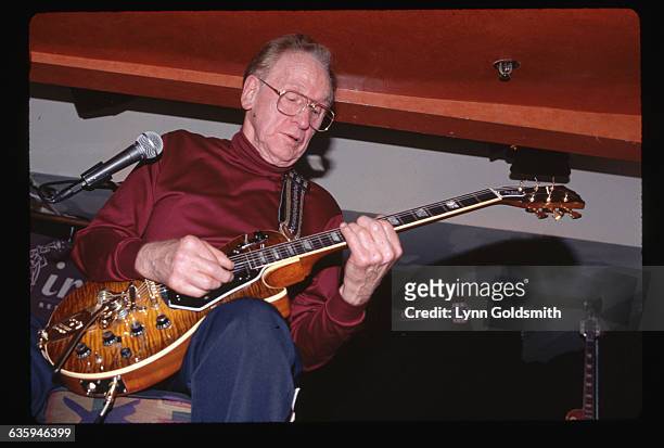 Picture shows legendary guitarist, Les Paul, playing the guitar inside.