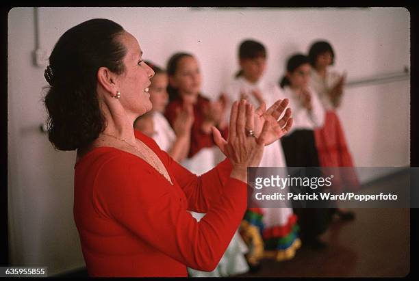 Dance instructor leads a group of young girls at a flamenco dancing class at Angelita Gomez's Escuelas De Baile Flamengo, Spain. Location: Escuelas...
