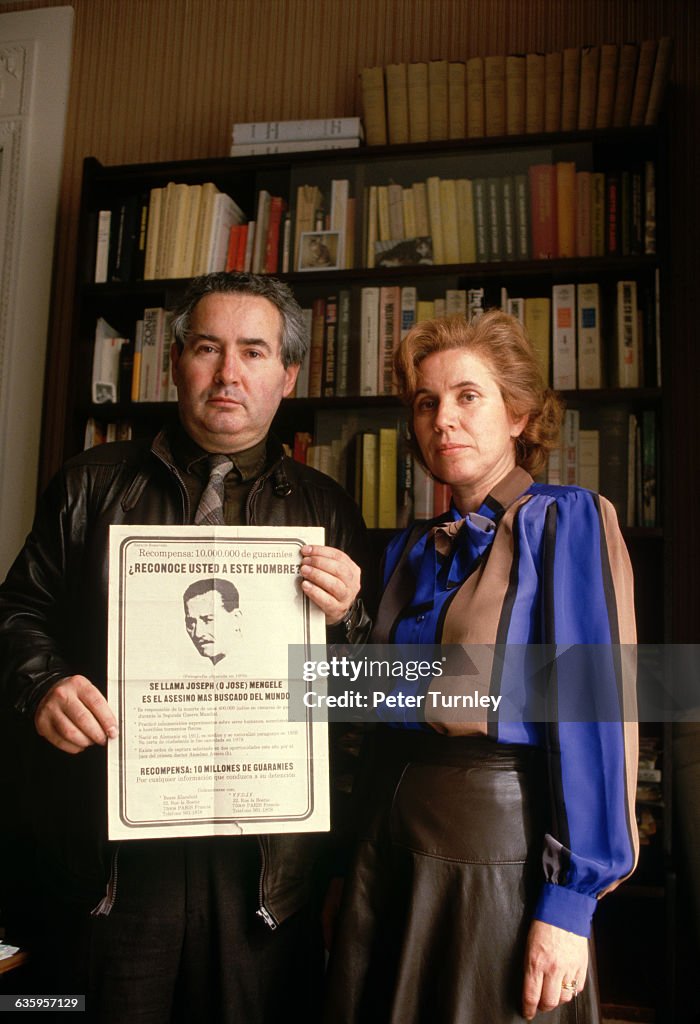 The Klarsfelds with a Poster of Josef Mengele