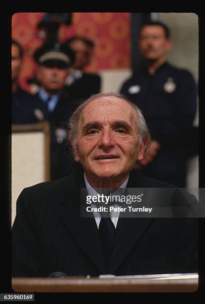Former Gestapo officer Klaus Barbie sits behind a glass screen before the Lyon Assize court at the opening of his trial. Barbie is accused of crimes...