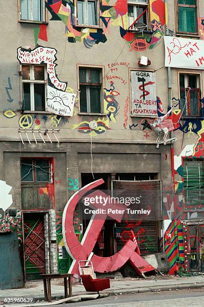 Building inhabited by squatters colorfully painted.