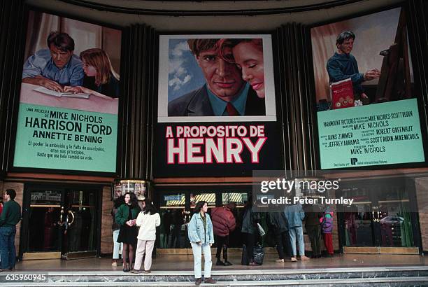 People Waiting in Front of a Movie Theater