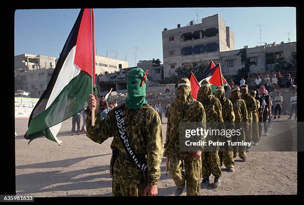 Masked members of the extremist group Hamas, called Azzediwi warriors, take part in a demonstration protesting the Israeli-Palestinian peace accord...