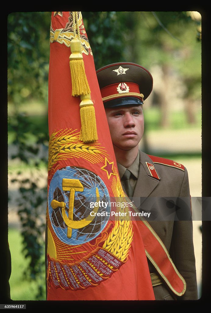 Soldier with Soviet Flag