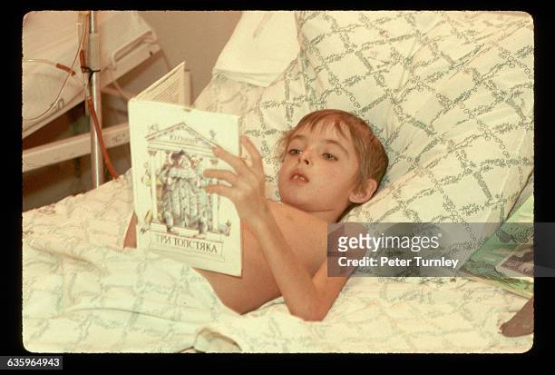 Soviet boy with a heart disorder rests in a hospital in the Ural Mountain of Chelyabinsk, USSR, during an economic depression. | Location: Tula, USSR.