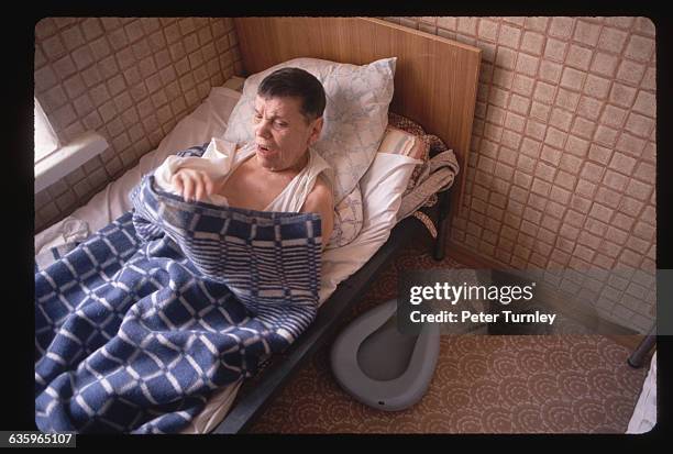 Russian Mental Patient in Bed