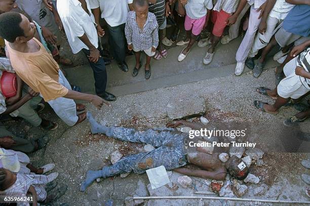 Reputed member of Haiti's right-wing paramilitary squads has been stoned to death in the night, a few weeks before the return of exiled President...