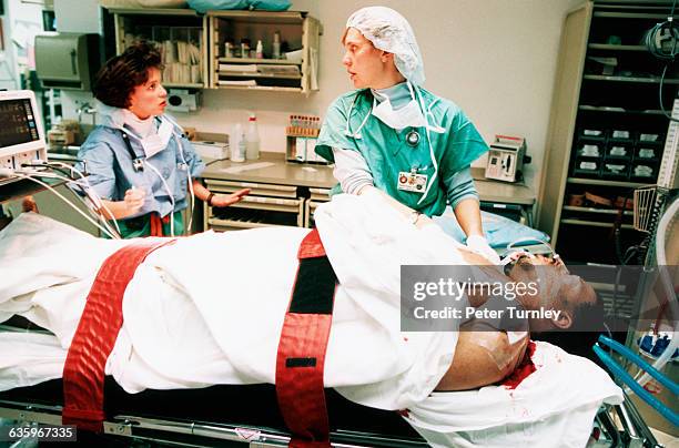 Bleeding trauma patient receives medical treatment in an emergency room at a Washington D.C. Hospital.