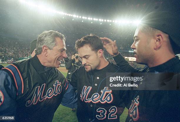 General Manager Bobby Valentine of the New York Mets congratulates Mike Hampton after the National League Divisional Series Game 5 against the St....