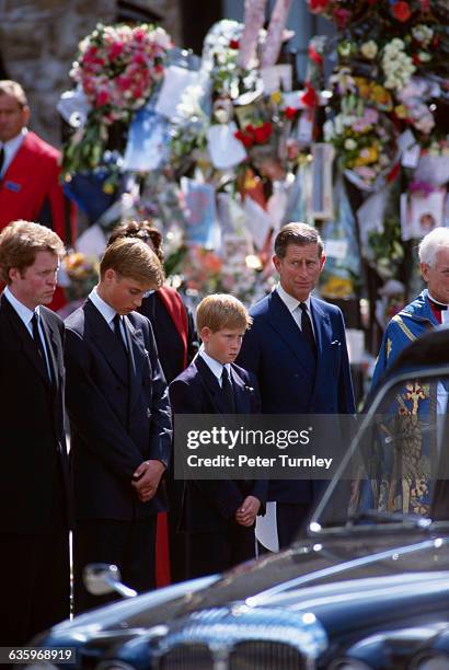 Earl Charles Spencer, the younger brother of Princess Diana, stands with Prince William, Prince Harry, and Prince Charles at the funeral of Diana,...