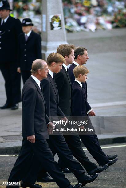 Philip, Duke of Edinburgh, Prince William, Earl Spencer, Prince Harry, and Charles, Prince of Wales walk behind Diana's casket during the funeral...