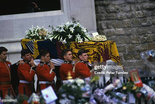 Guardsmen of the Prince of Wales Company of the Welsh Guards carry Diana's casket out of Westminster Abbey following the funeral of Diana, Princess...